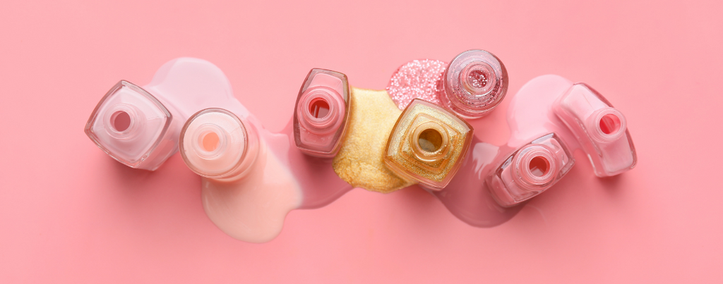 Various oil based nail polish in pink background